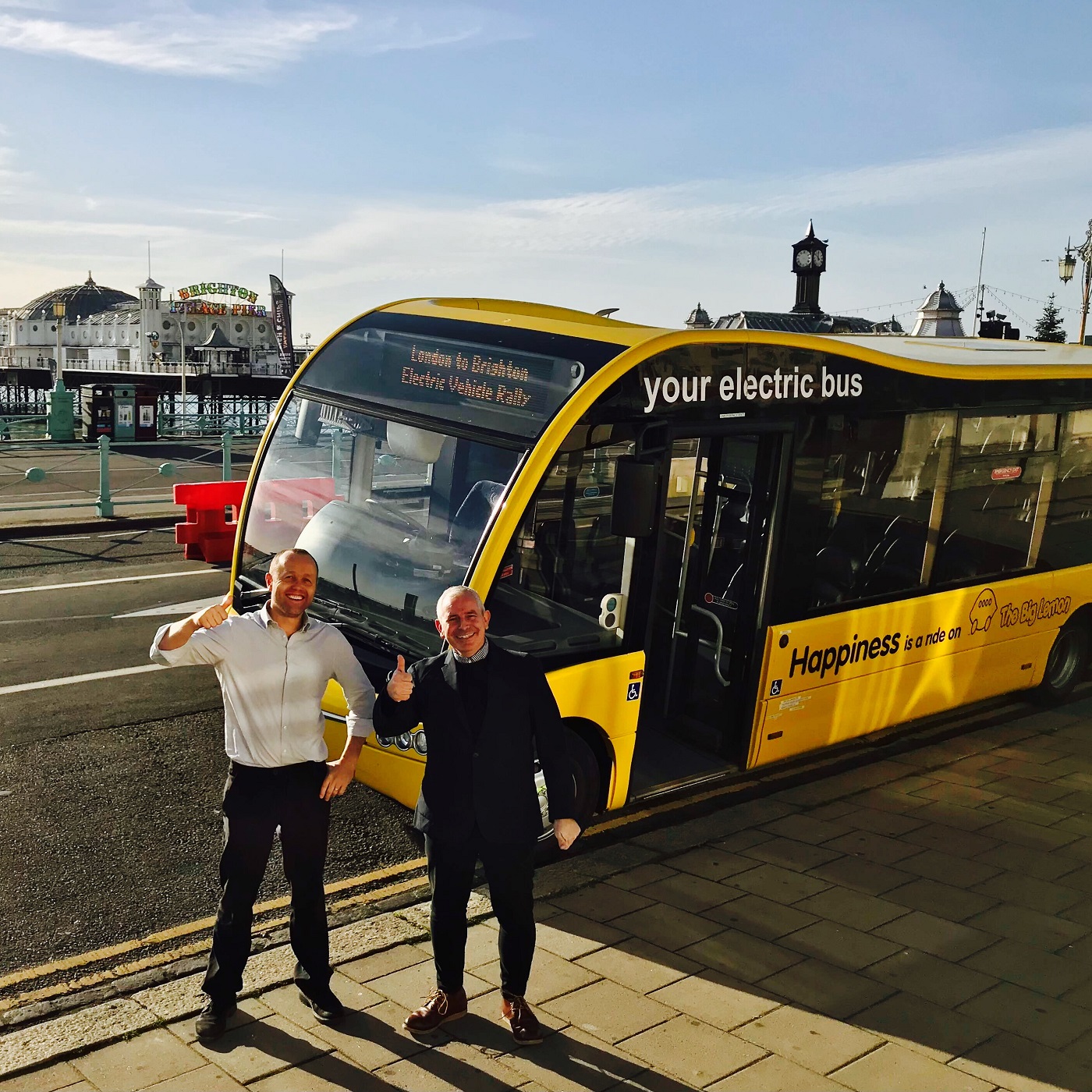 Big Lemon Electric bus on Brighton seafront social enterprise uk