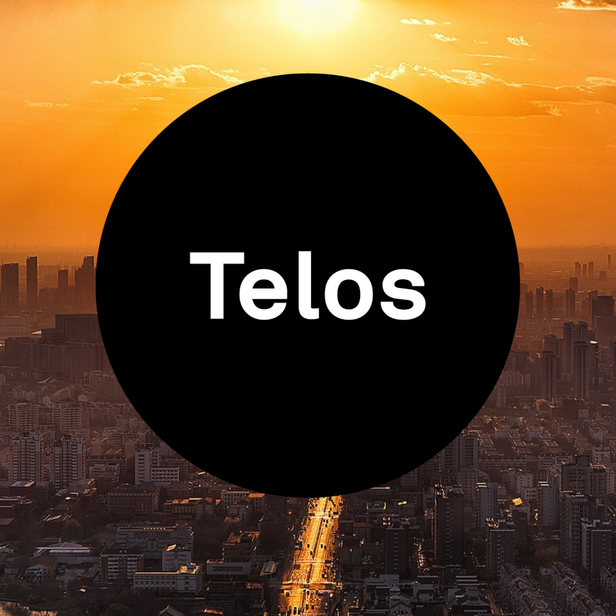 The Telos logo a black circle with the word telos on it superimposed over a cityscape at sunset