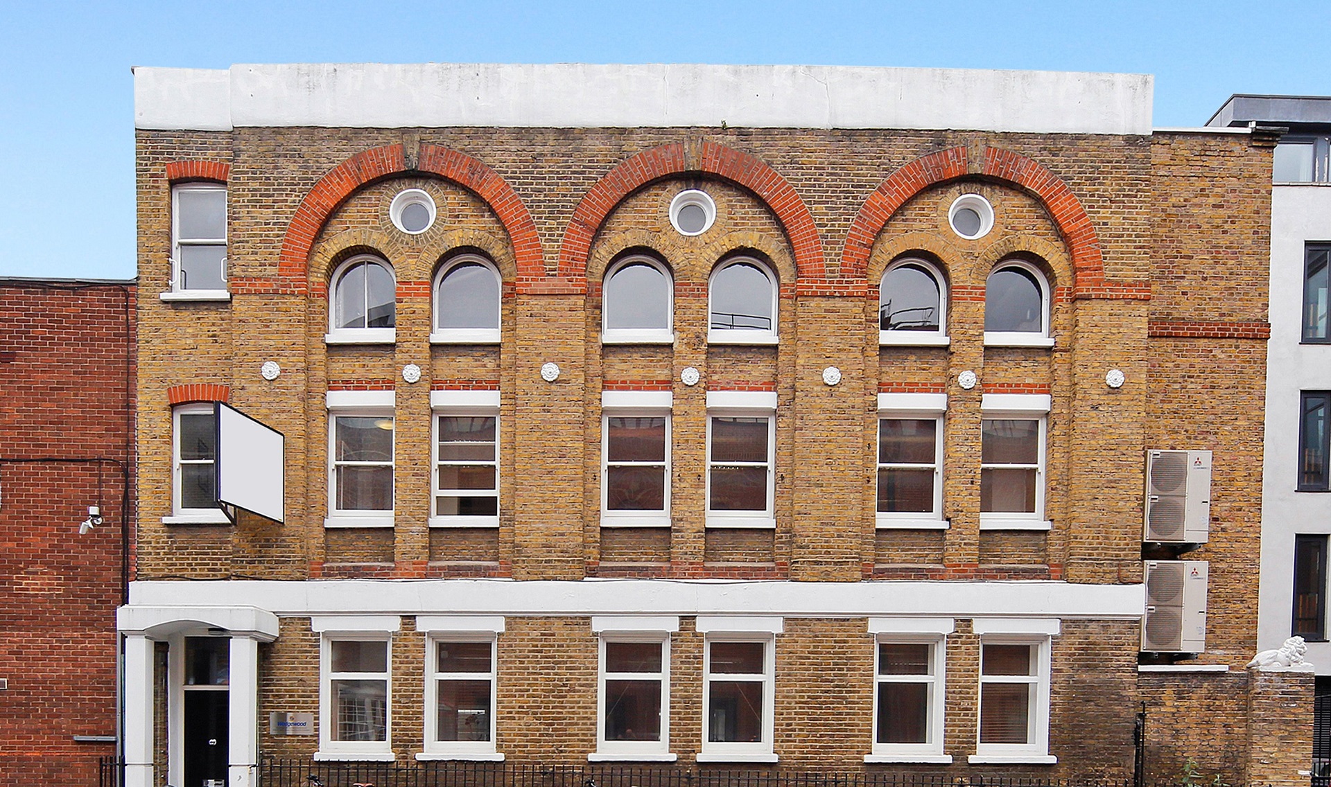 the front of our new building 13 Dock Street a red brick former warehouse