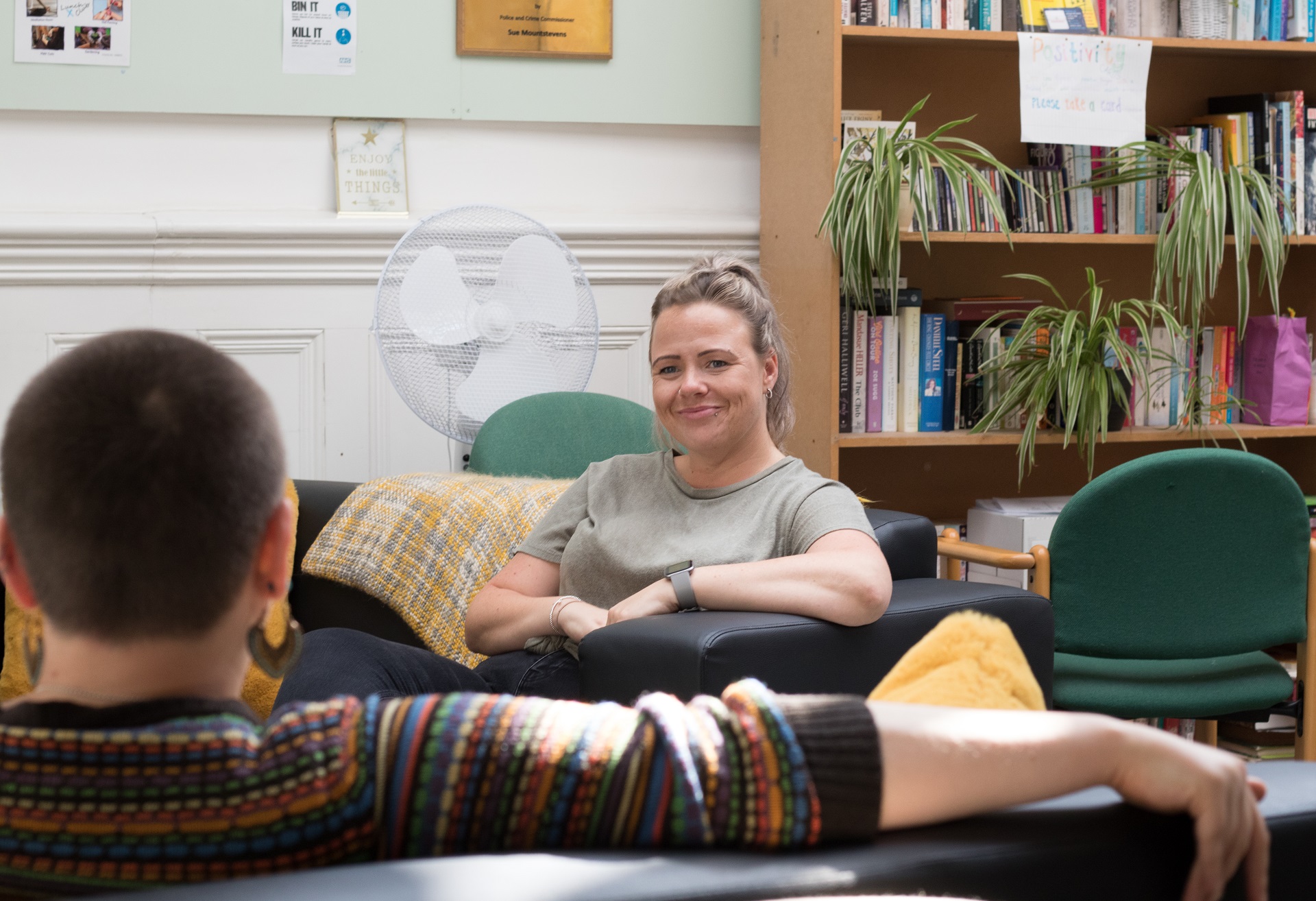 Picture shows a woman with blond hair interviewing someone at the Nelson Trust