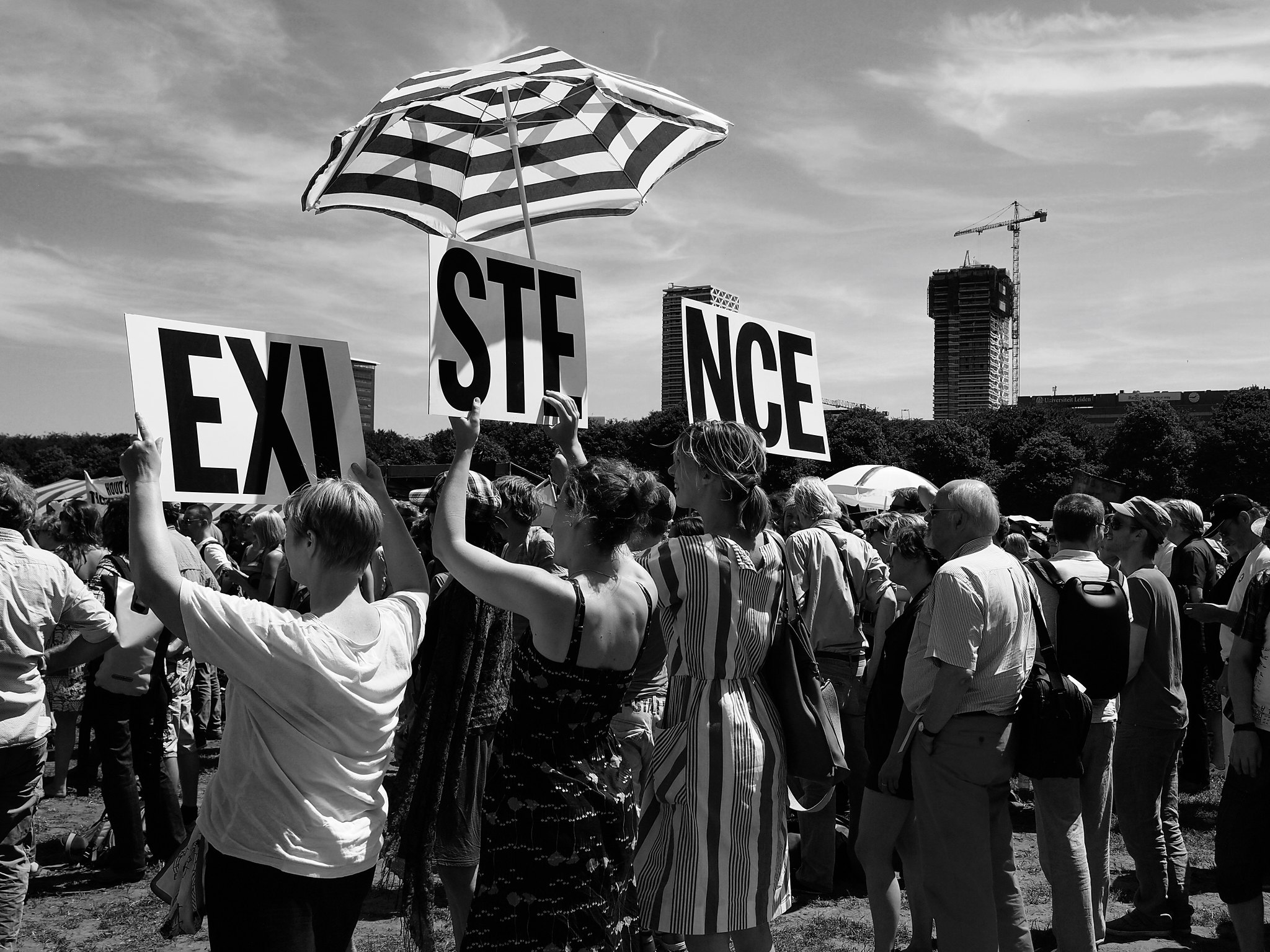 campaigners holding up a sign saying existence