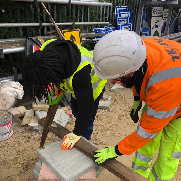 Two men in high vis jackets from Skill Mill